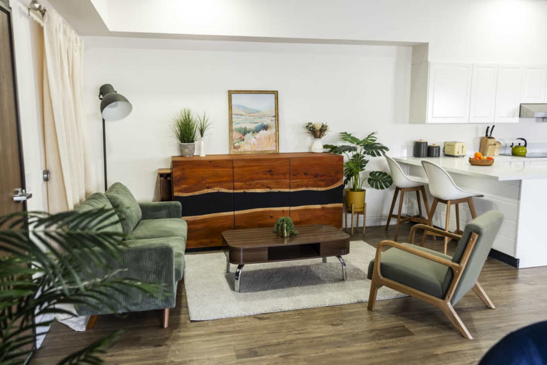 Living area with two green sofas