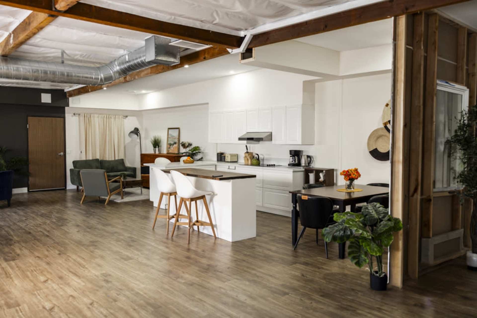 Open-concept kitchen and dining with a central island and natural light